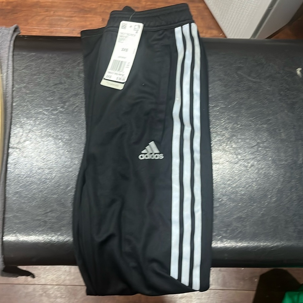 NWT size 2XS adudas unisex sweat pants. Zip up bottoms. Black, silver